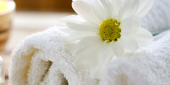 Photo of spa towels and a flower